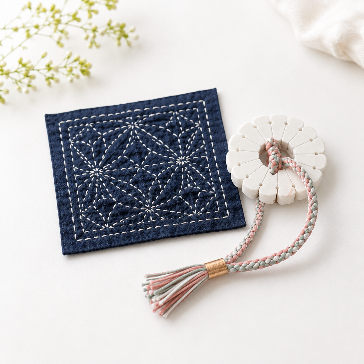 Sashiko stitching and kumihimo braiding